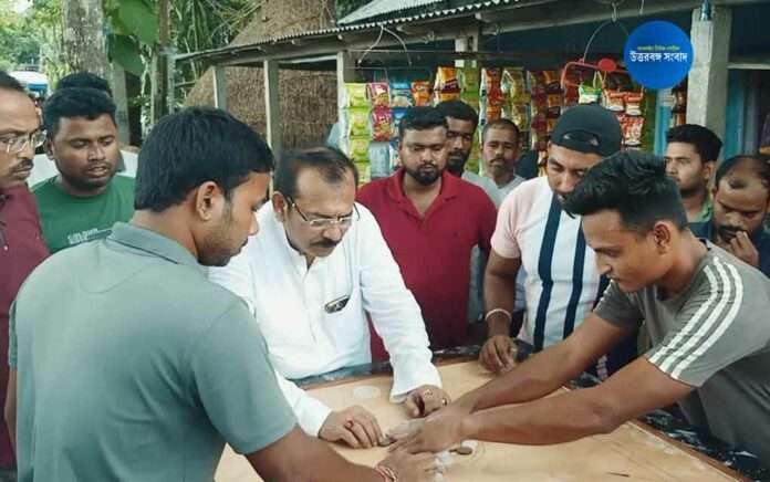 Minister Arup Biswas plays carrom at dinhata