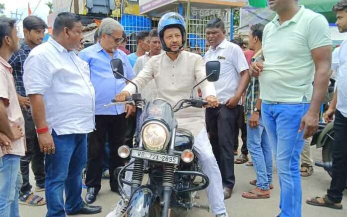 Rajiv Banerjee in Chalsa campaigning by bike