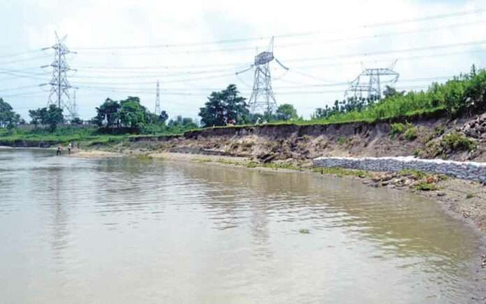 the Mahananda is swallowing the village by breaking the embankment