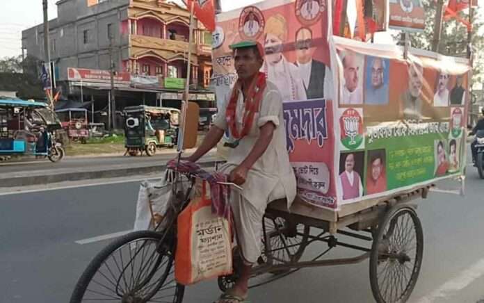 a old man campaigning in a van to support sukanta majumder